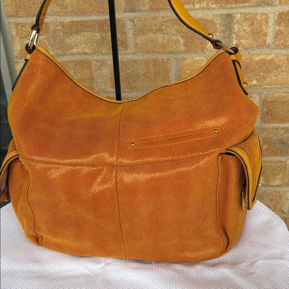 B. Makowsky Orange Hobo Bag